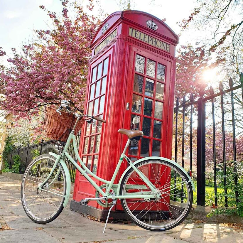 Bike next to red telephone box